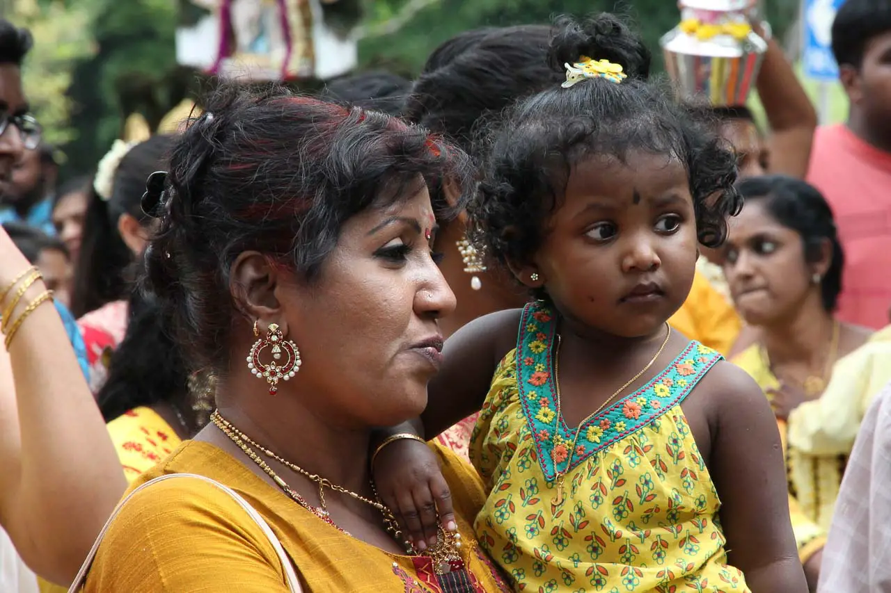 Tamil woman holding toddler