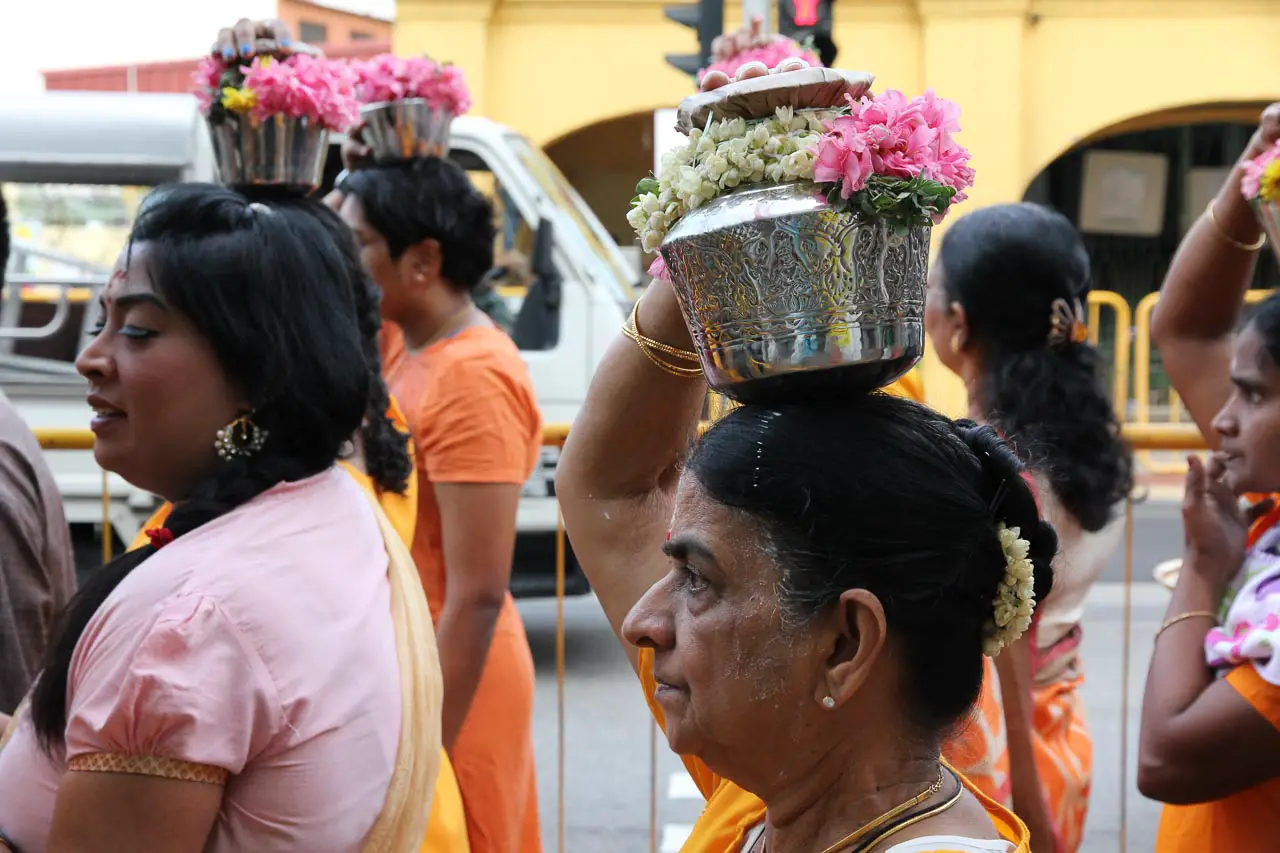 Women carrying milk during Thaipusam