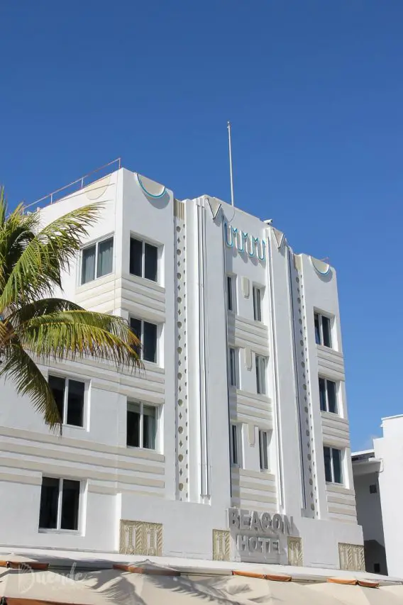 The whit and sand coloured, art deco exterior of the Beacon Hotel, set against blue sky