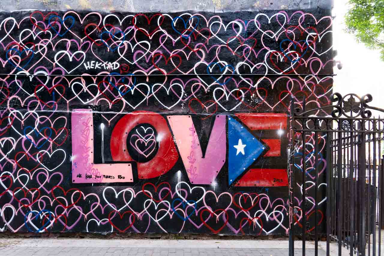 Mural of hearts with the word "Love" and the Puerto Rican flag