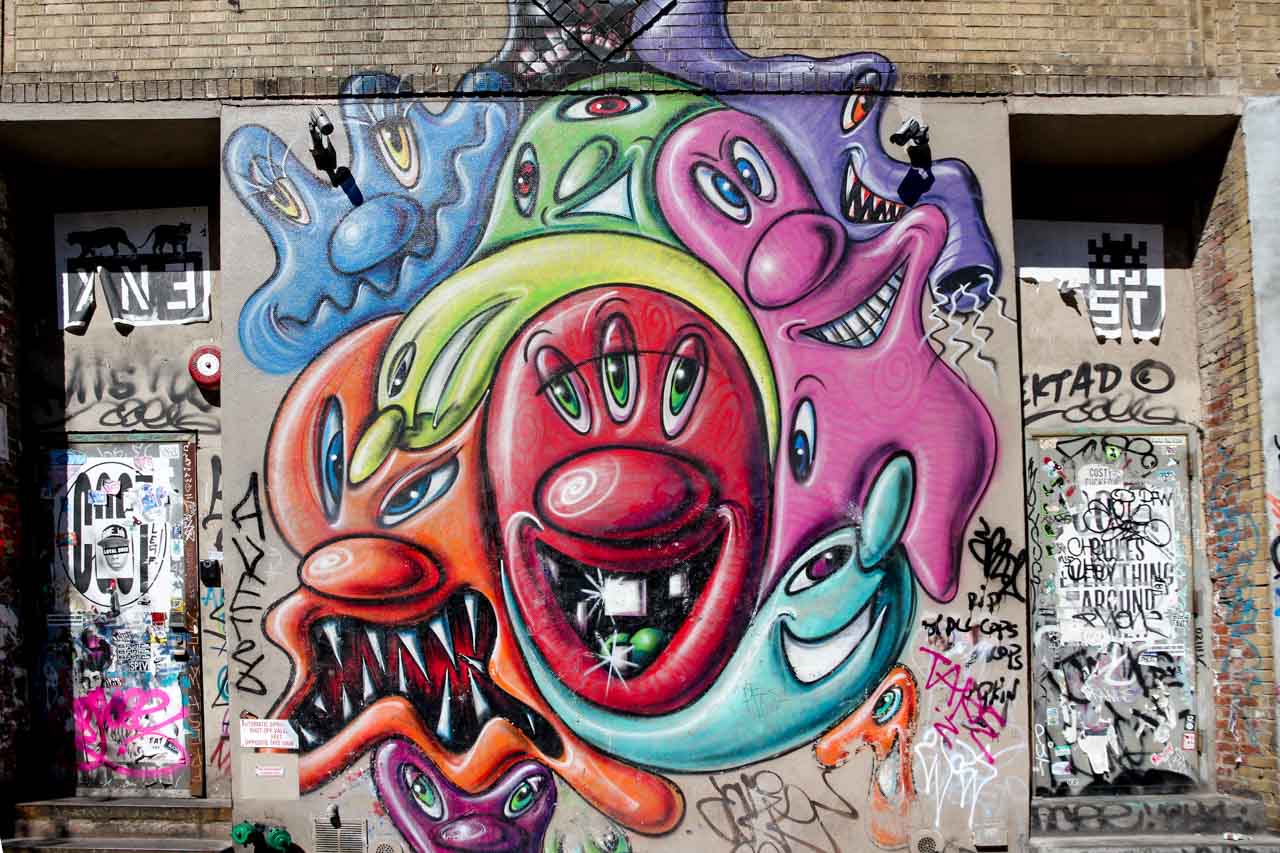 Kenny Scharf's signature characters on a wall in the Lower East Side