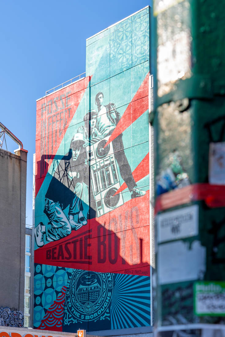 8-story mural representing the Beastie Boys in red, turquoise and black