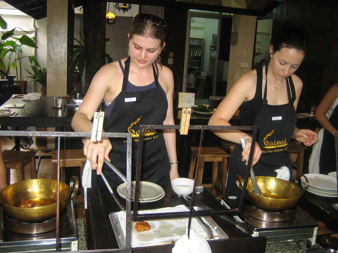 My travel companion Susie, and I cooking up a storm in golden coloured woks