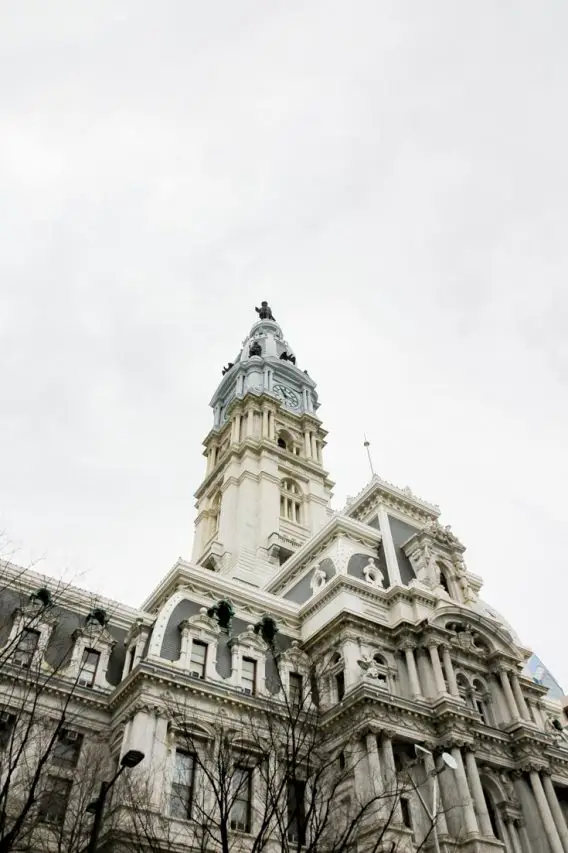 Photo of Philadelphia City Hall tower with Penn statue on top and grey sky