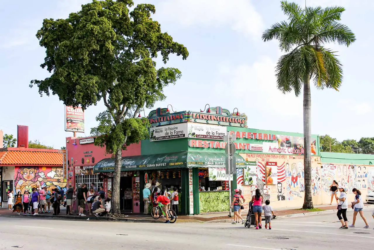 People queuing outside La Esquina De La Fama restaurant on corner in Calle Ocho