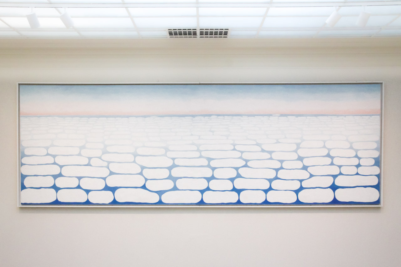 Georgia O'Keefe painting of clouds viewed from above on museum wall