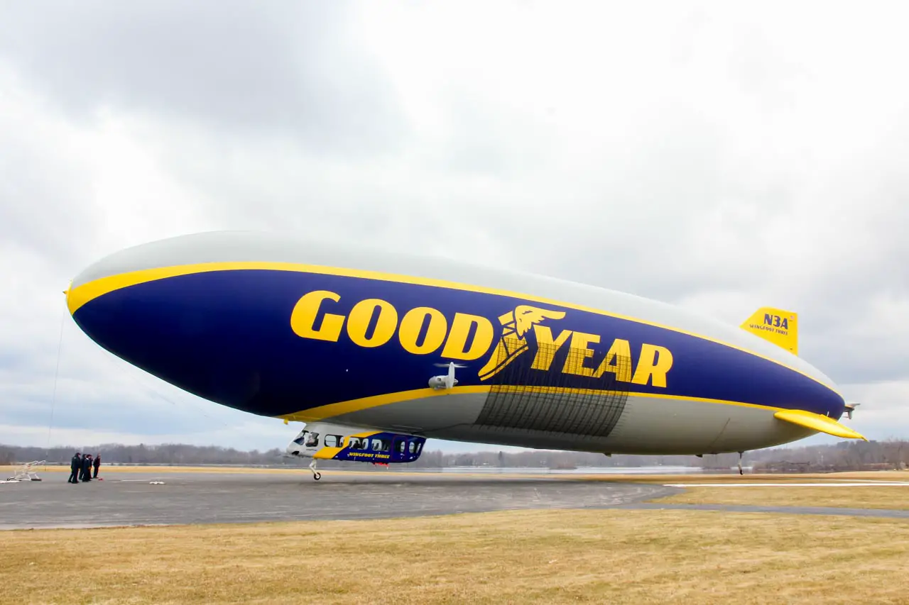 Goodyear Blimp floating just above the ground at the airdock