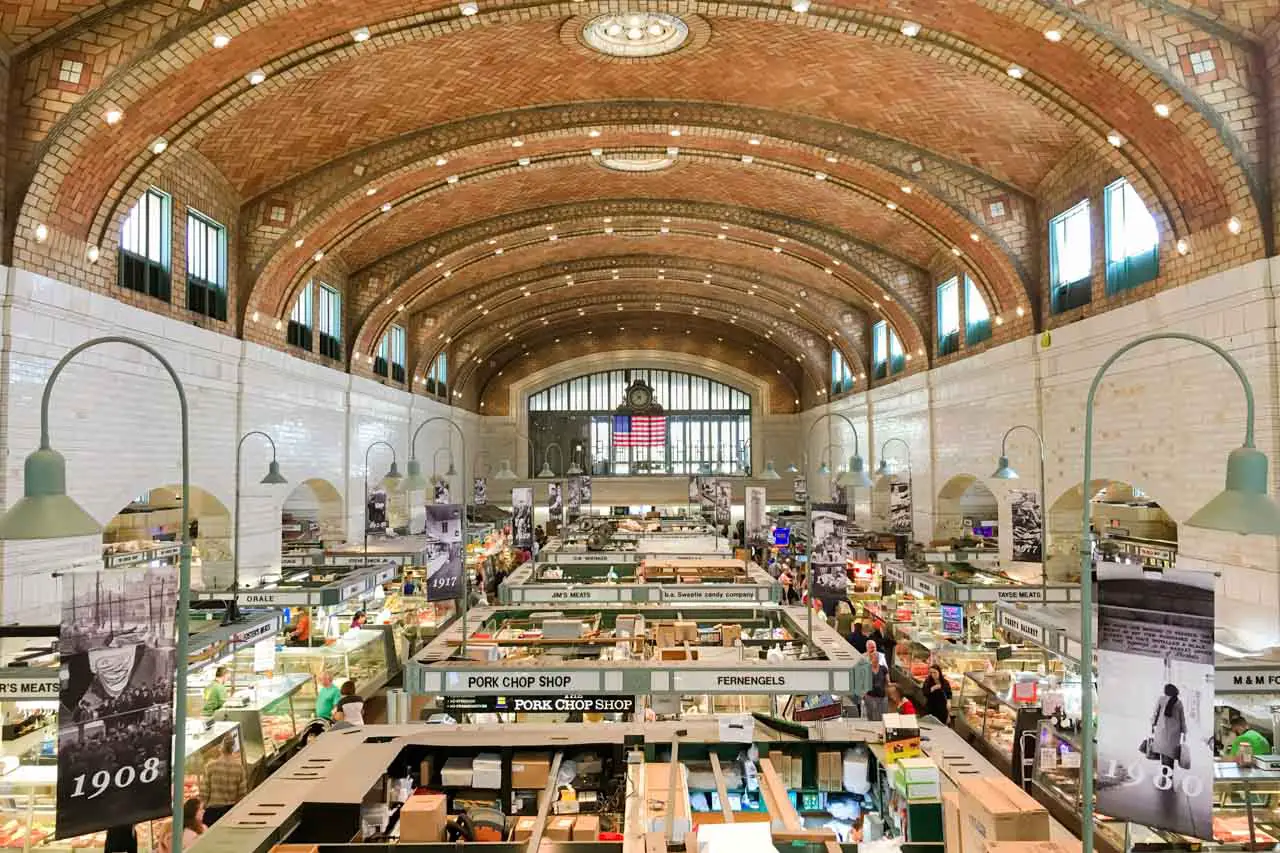 Photo of the interior of Westside Market with stall arched, brick ceiling.