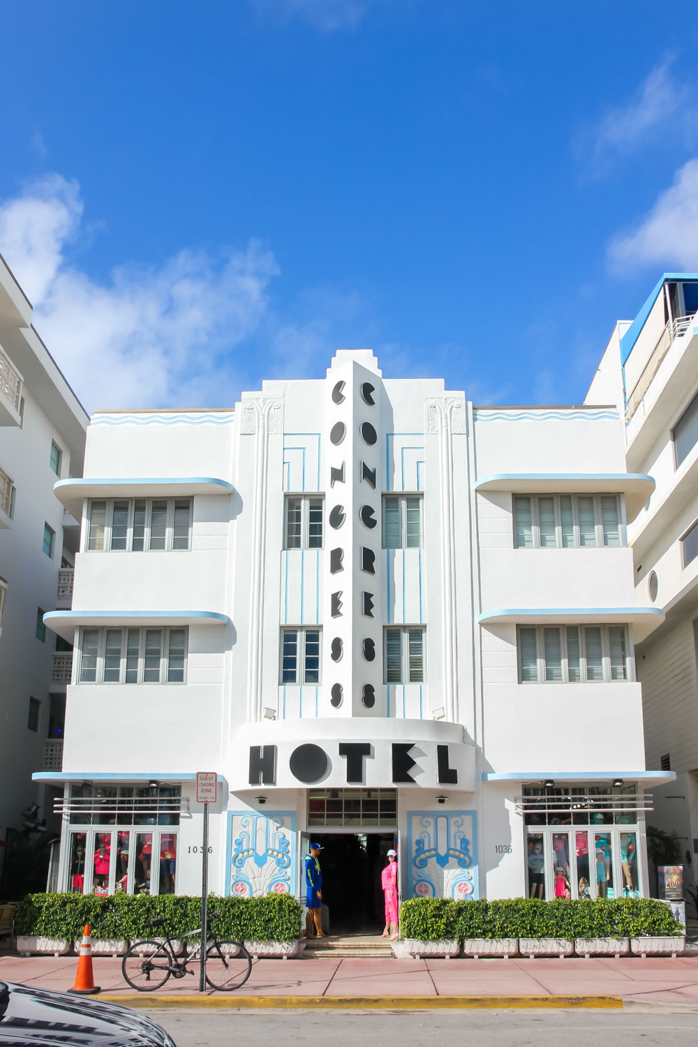 Front of art deco hotel with Congress Hotel written in geometrical black typeface