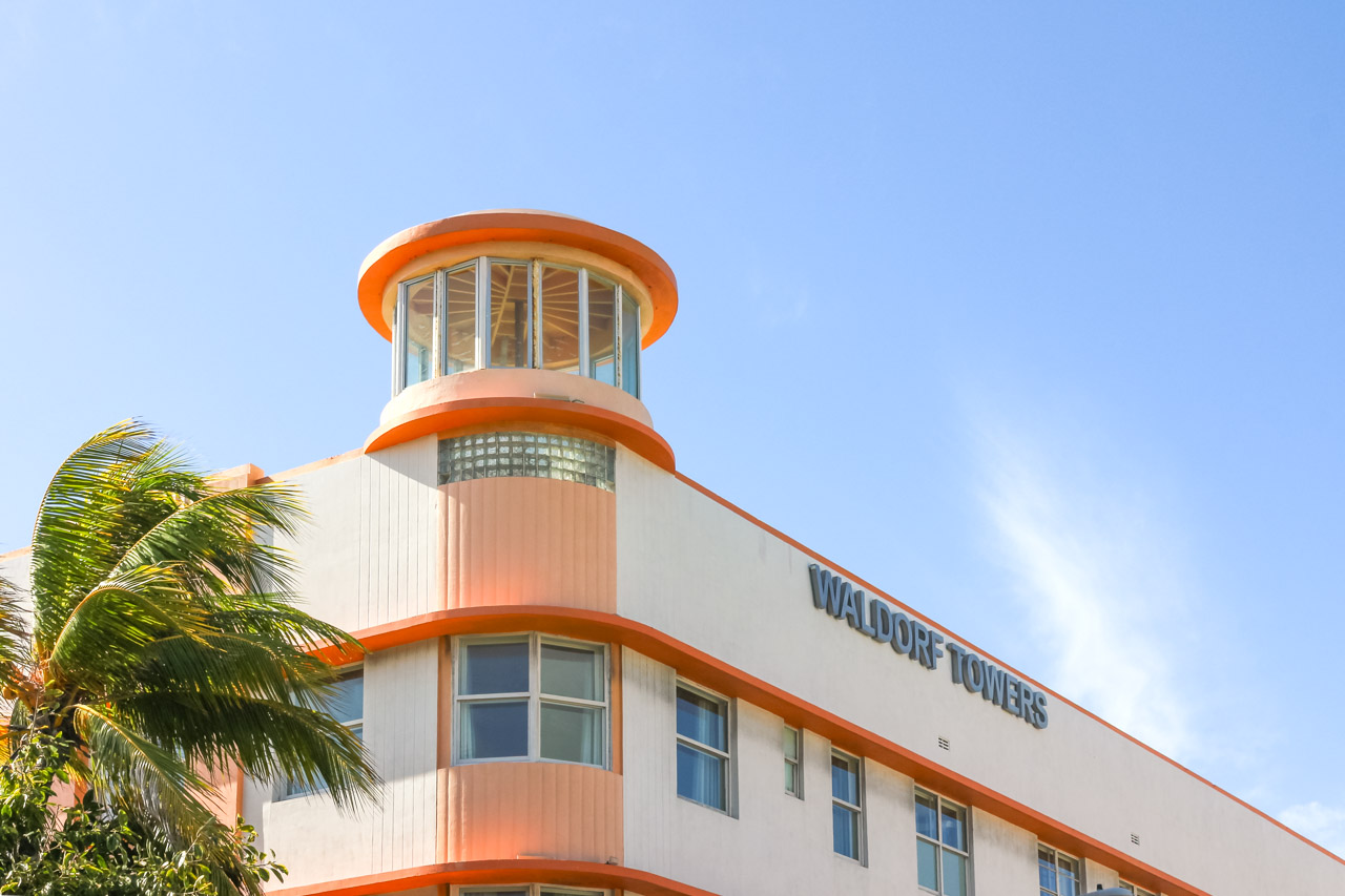 The lighthouse inspired corner of Waldorf Towers against blue South Beach skies