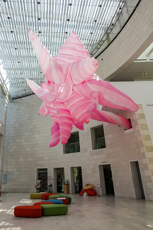 Abstract pink inflatable hanging from Museum ceiling