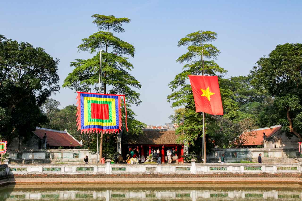 Flags over the reflecting pool at the Temple of Literature, Hanoi