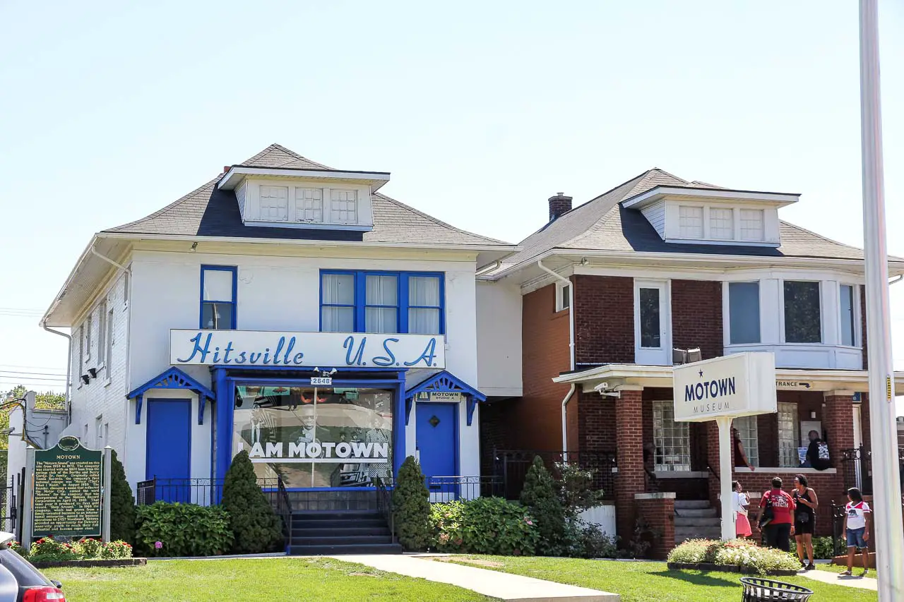 Exterior of two similar homes with signs for "Motown" and "Hitsville, USA"