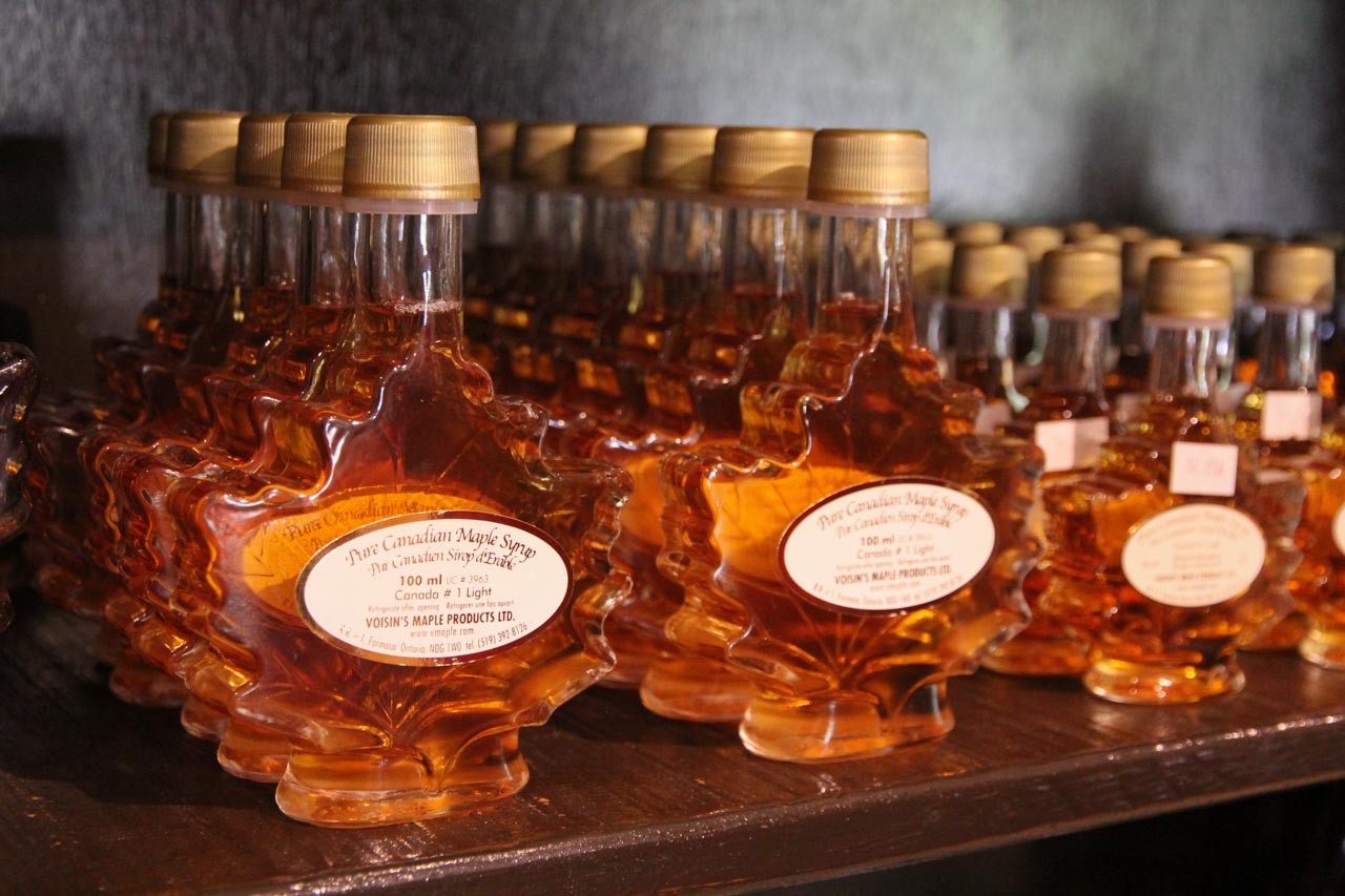 Maple-leaf shaped bottles of Canadian maple syrup, in a shop display