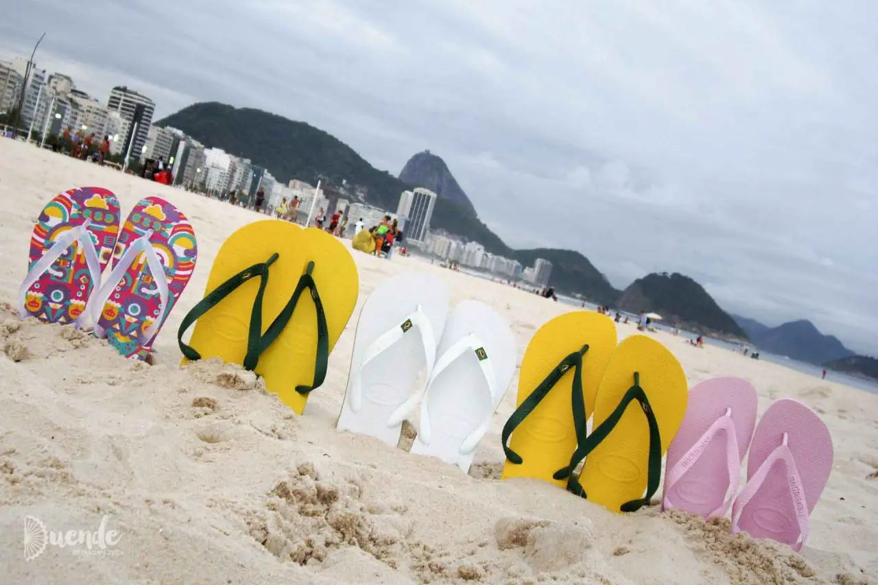 A row of Havianas on Copacabana Beach with Sugarloaf Mountain in the distance