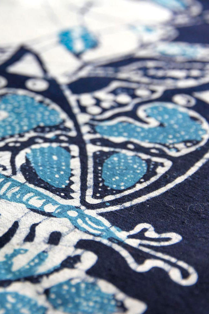 Blue and white batik print of a butterfly