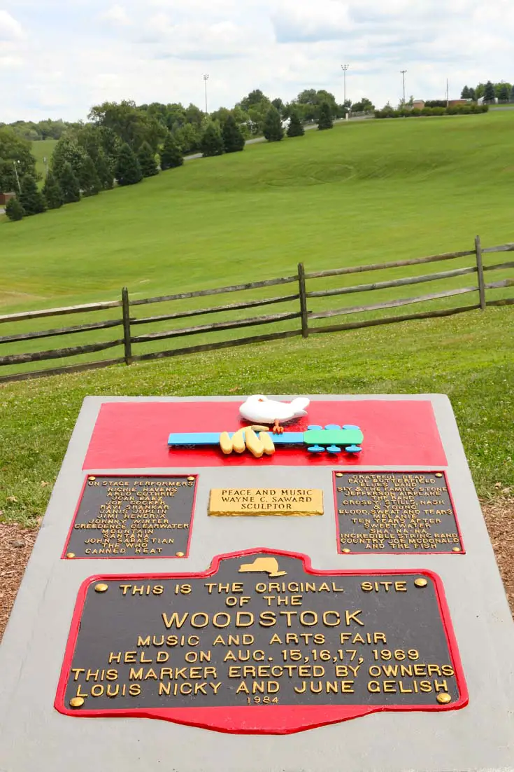 Woodstock Monument overlooking open field with peace sign mown into hillside