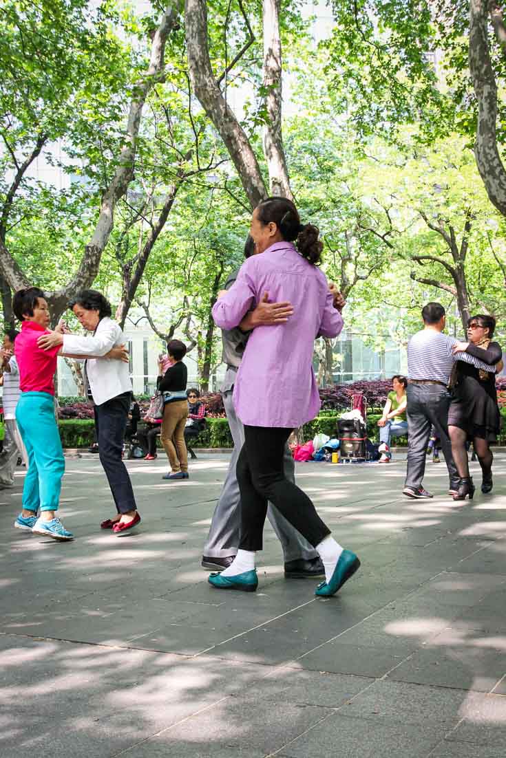 Couples dancing in Fuxing Park on a sunny day