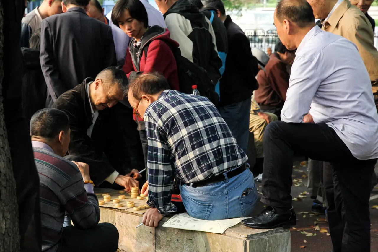 Men playing a game of xiangqi