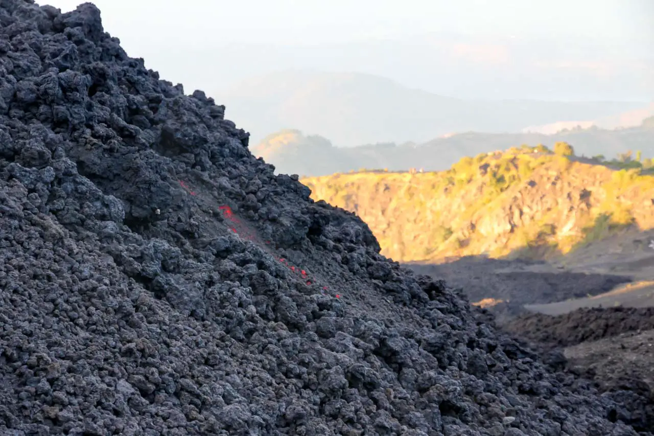 Face of the lava flow with molten red showing through