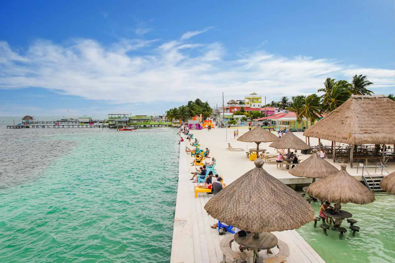 People enjoying the sun by the water on Caye Caulker.