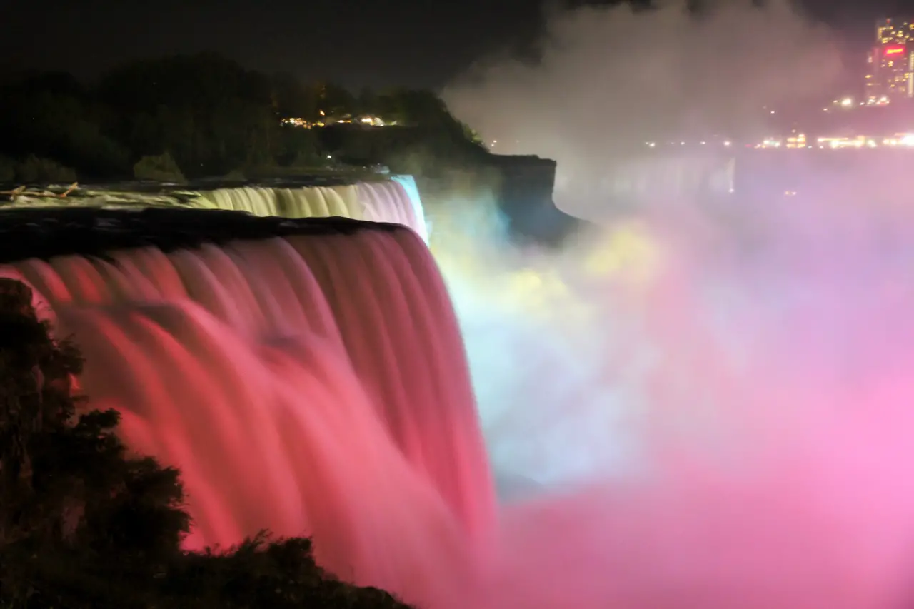 Niagara Falls viewed at night lit up in various colours