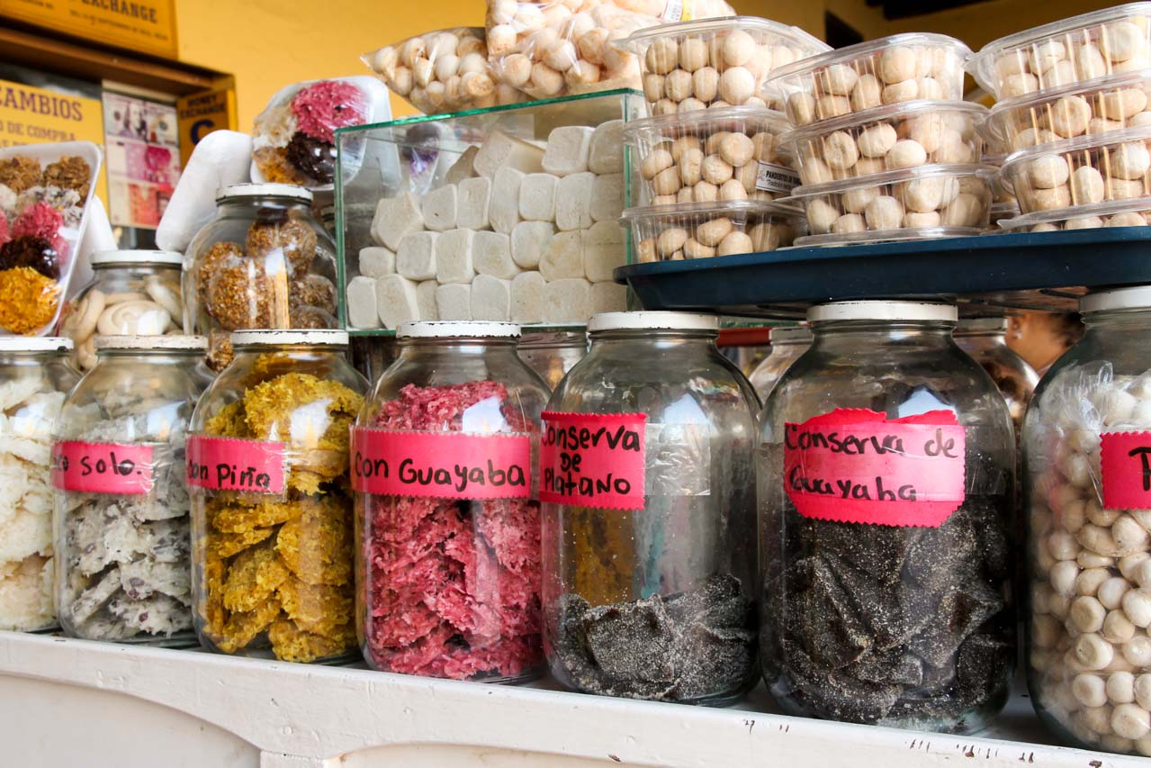 Sweets for sale, displayed in large glass jars in the market