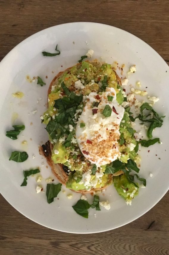 Avocado toast topped with poached egg