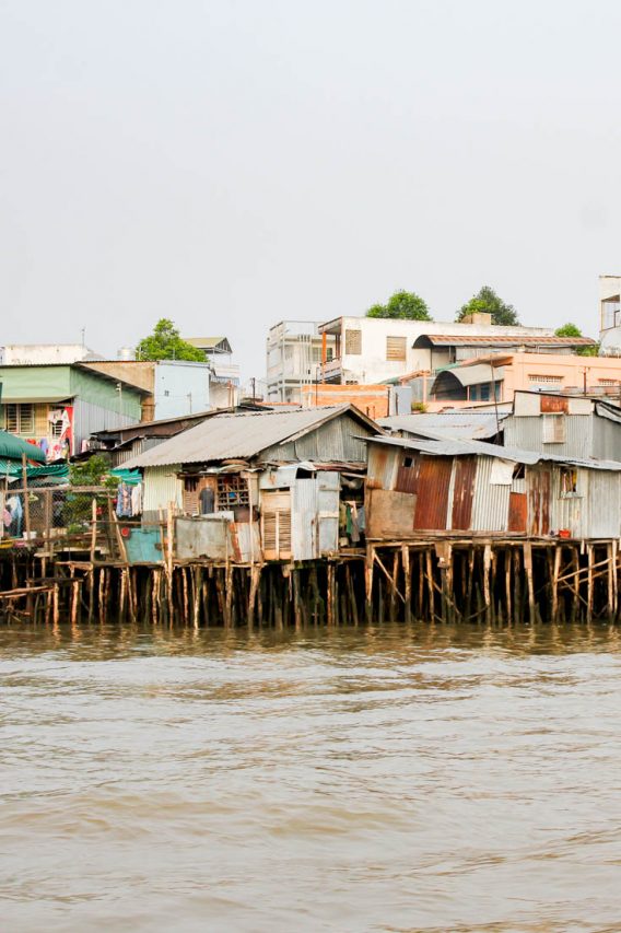 Homes on stilts along the Mekong River banks.