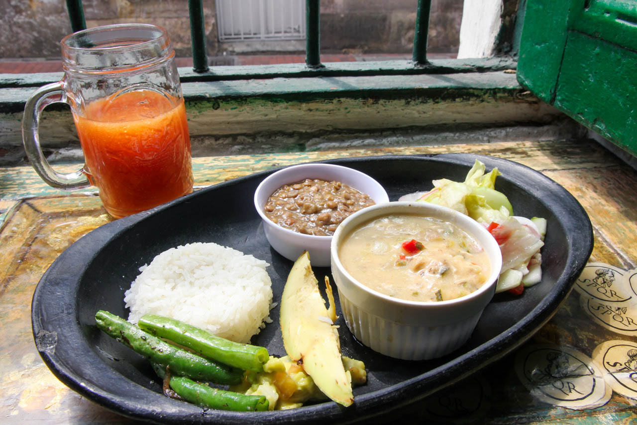 Set menu lunch in Bogota cafe with soup, rice and cooked vegetables