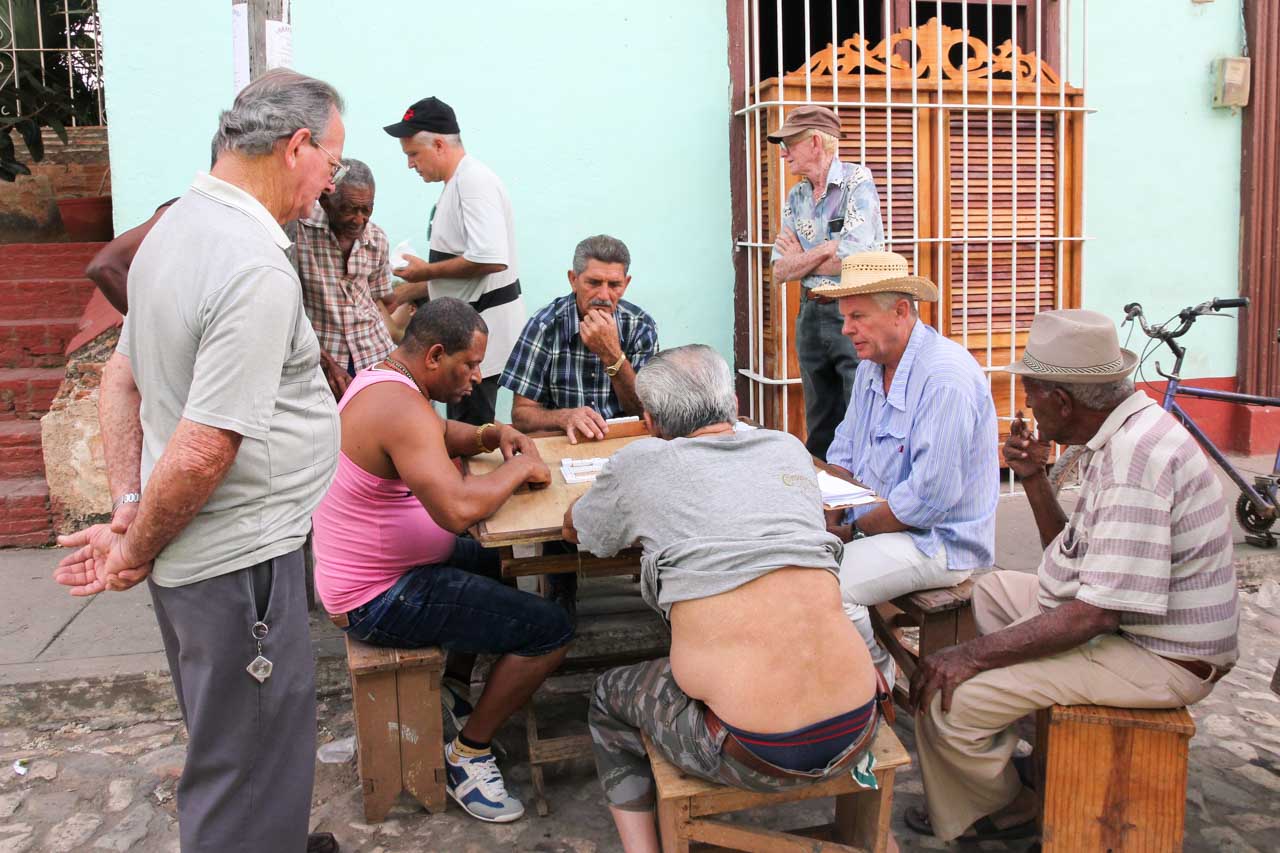 Older men playing dominoes in the street