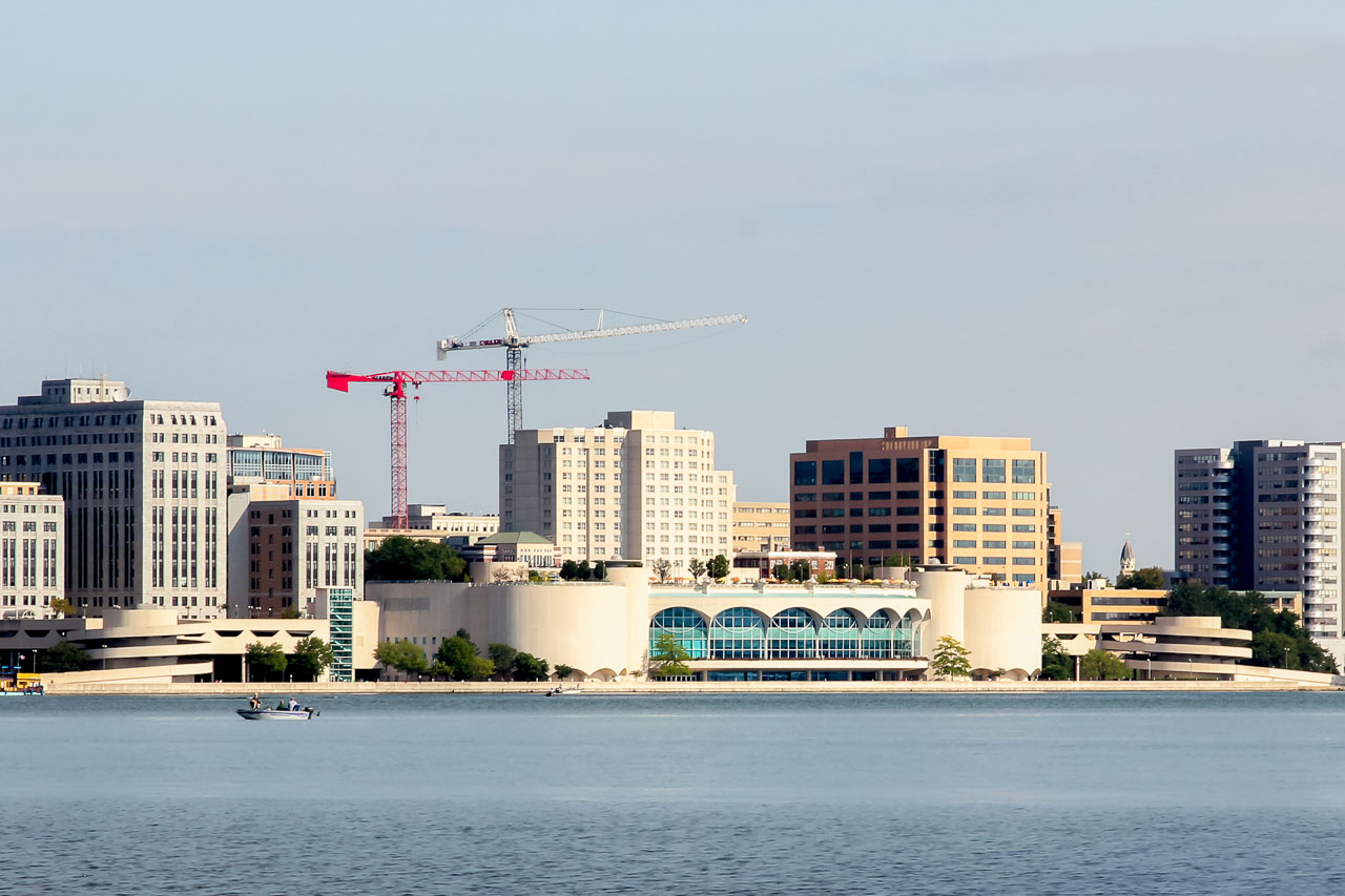 Monona Terrace Convention Center viewed across Lake Monona with city buildings in the background