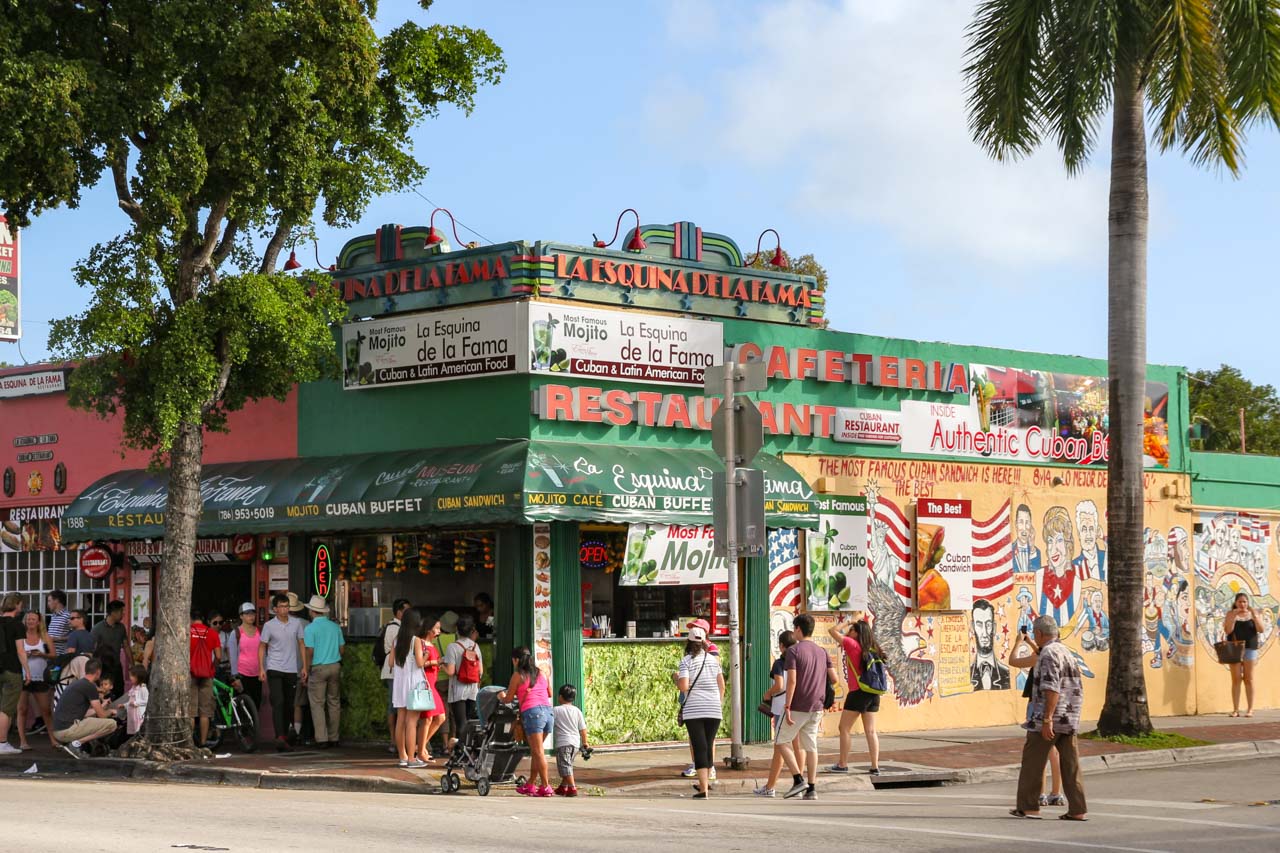 People queuing outside La Esquina De La Fama restaurant on corner in Calle Ocho