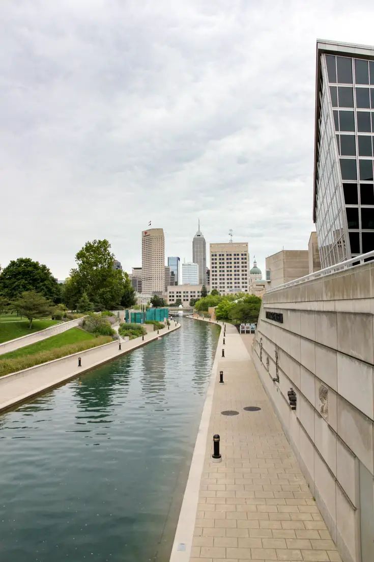 Image of canal leading to city skyline in the distance