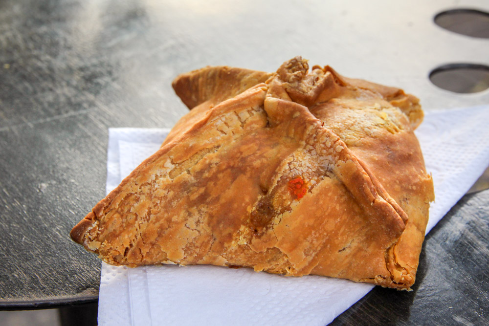 Jamaican pattie on triangle-folded napkin
