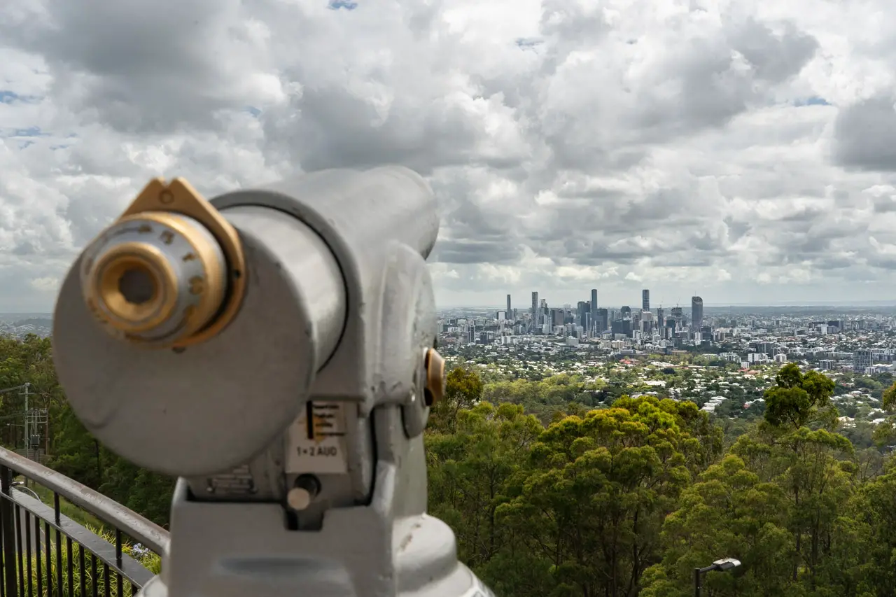 View looking down over Brisbane city with telescope in the foreground