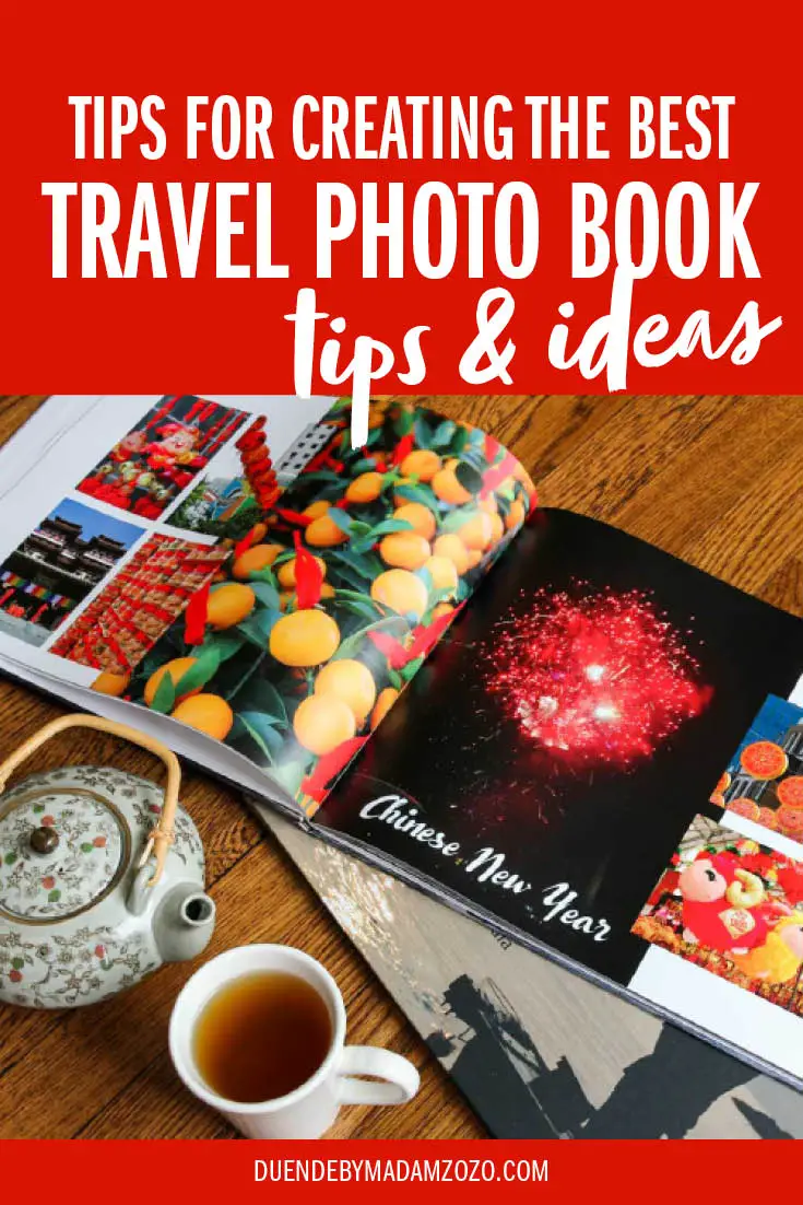 Photo books filled with travel photos on a wooden tabletop with teapot and cup. Title overlay reads "Tips for creating the best travel photo book - tips and ideas"