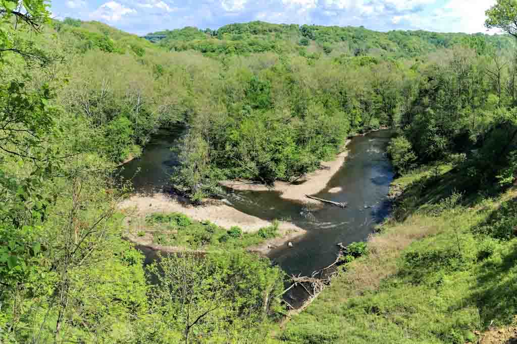 Overlook view meander in Cuyahoga River with lush green forest through to the horizon