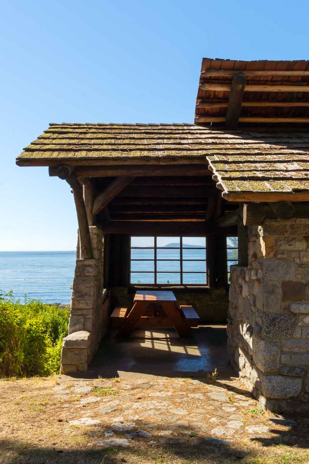 Picnic shelter with window to blue waters and sky beyond