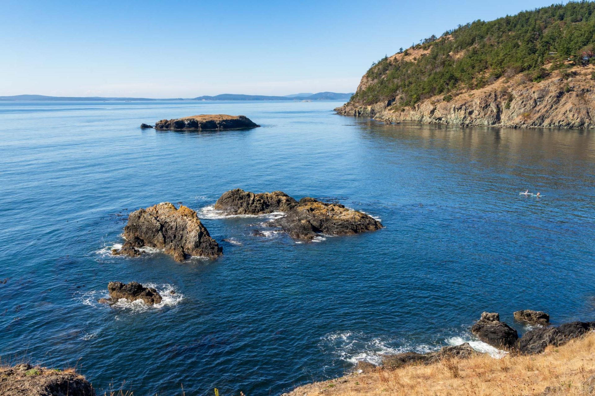 View of San Juan Islands from Rosario Headland, Deception Pass State Park with rocky islets in foreground