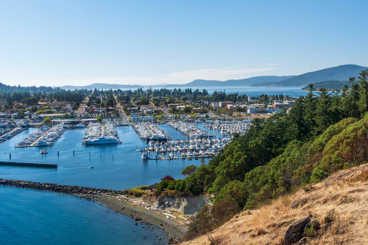 View over marina with town and more islands in the background