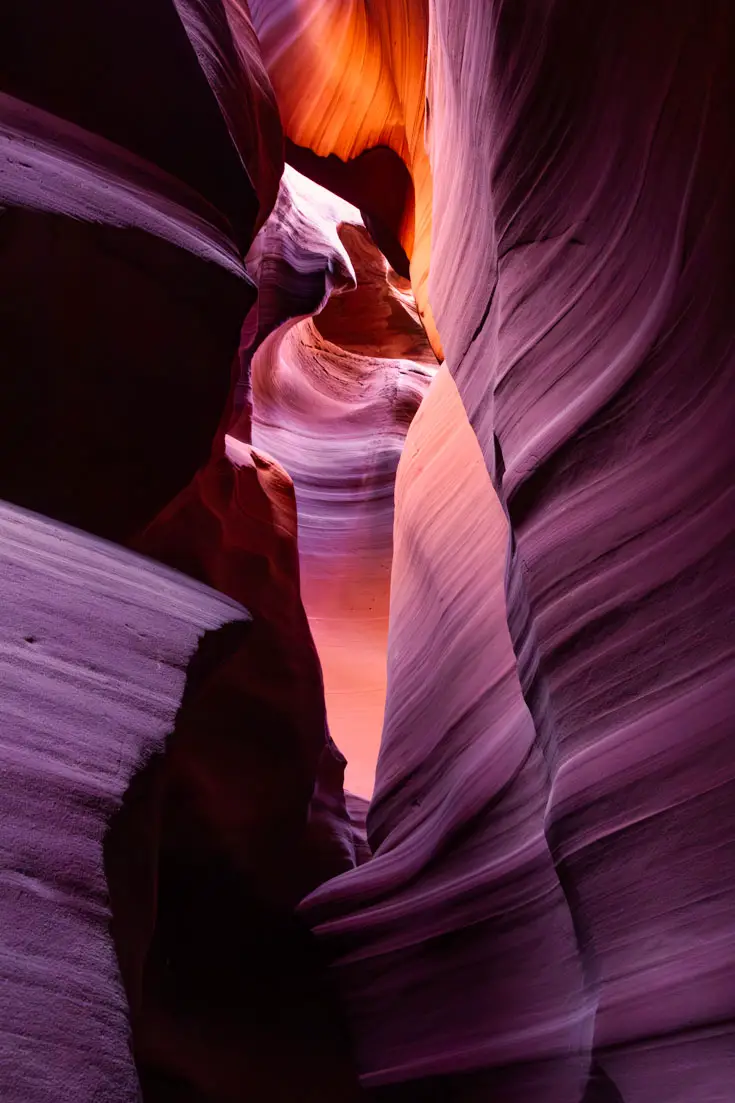 Light creatign red, purple and orange light on canyon walls