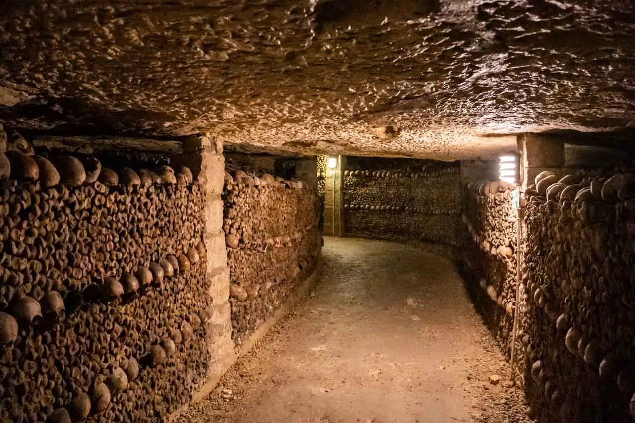 Bone-lined corridor in the Paris Catacombs