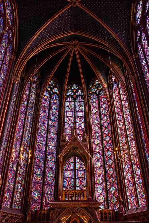Stained glass-lined chapel in reds, blues and purples