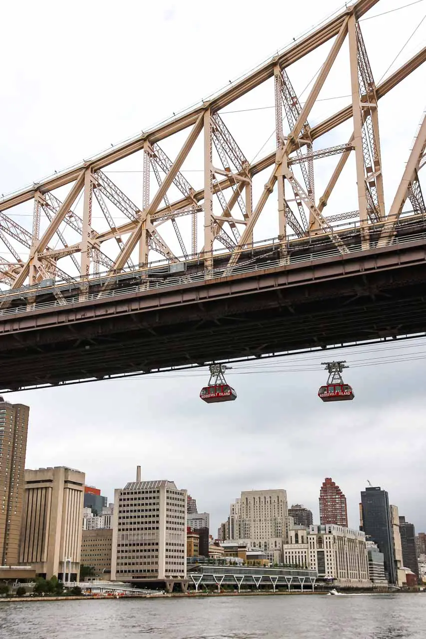 Queensboro Bridge and the Roosevelt Island Tramway with view back to Manhattan Island buildings