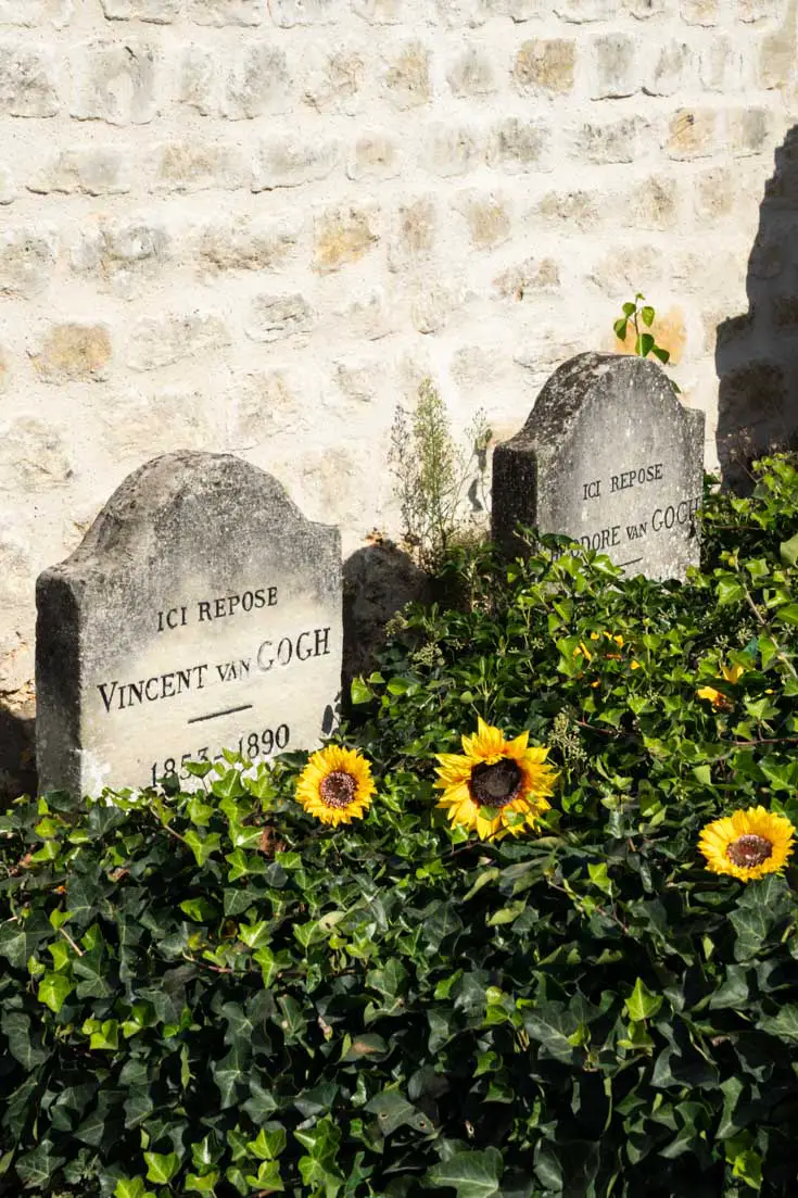 Headstones of Vincent and Theo Van Gogh with faux sunflowers