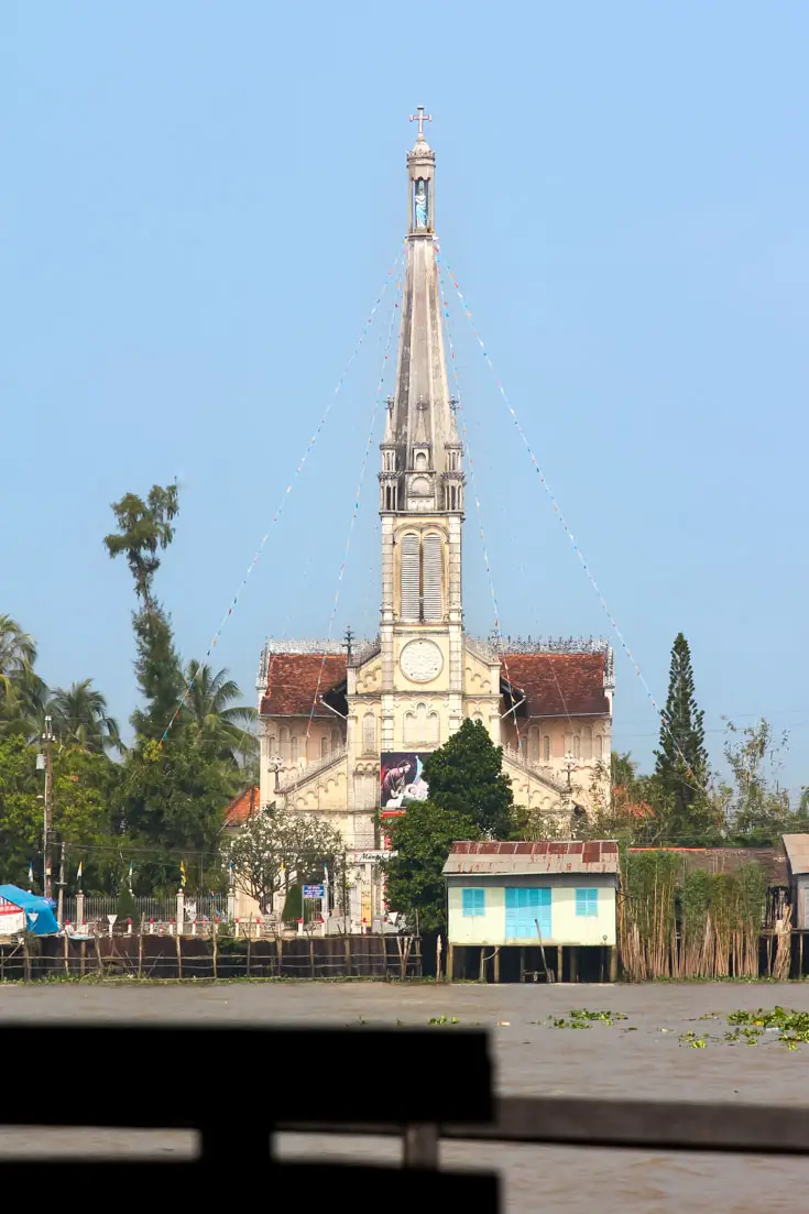 White catholic church at Cai Be, on the Mekong River