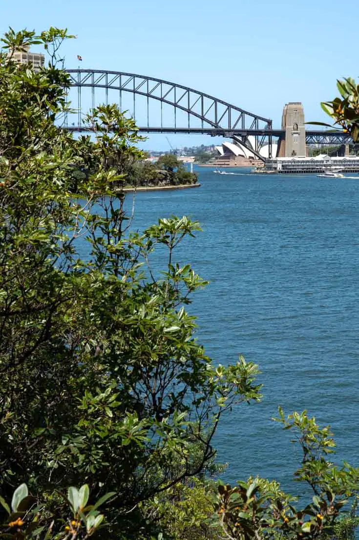Sydney Harbour Bridge and Opera House in distance across Harbour on sunny day