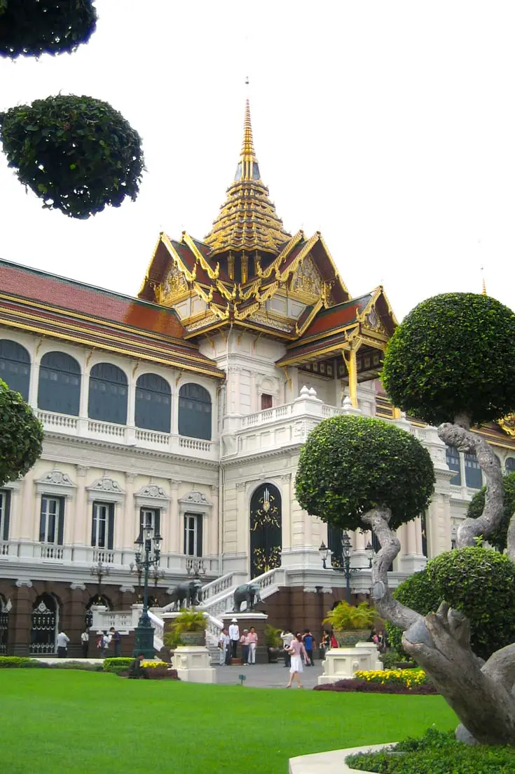 Colonial style building with Thai flourishes and manicured landscaping