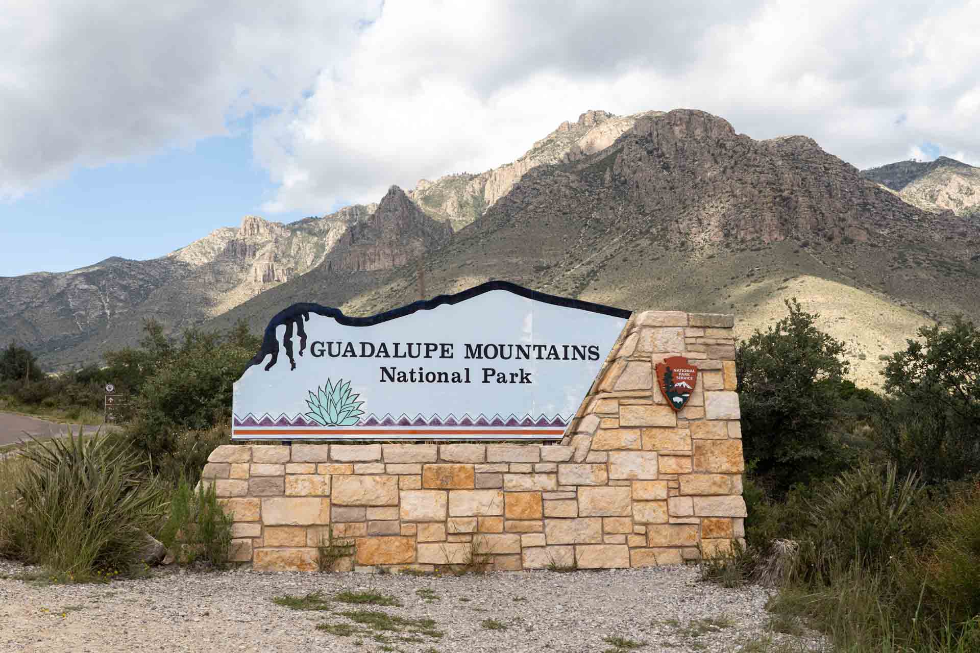 Guadalupe Mountains National Park sign with mountains in the background